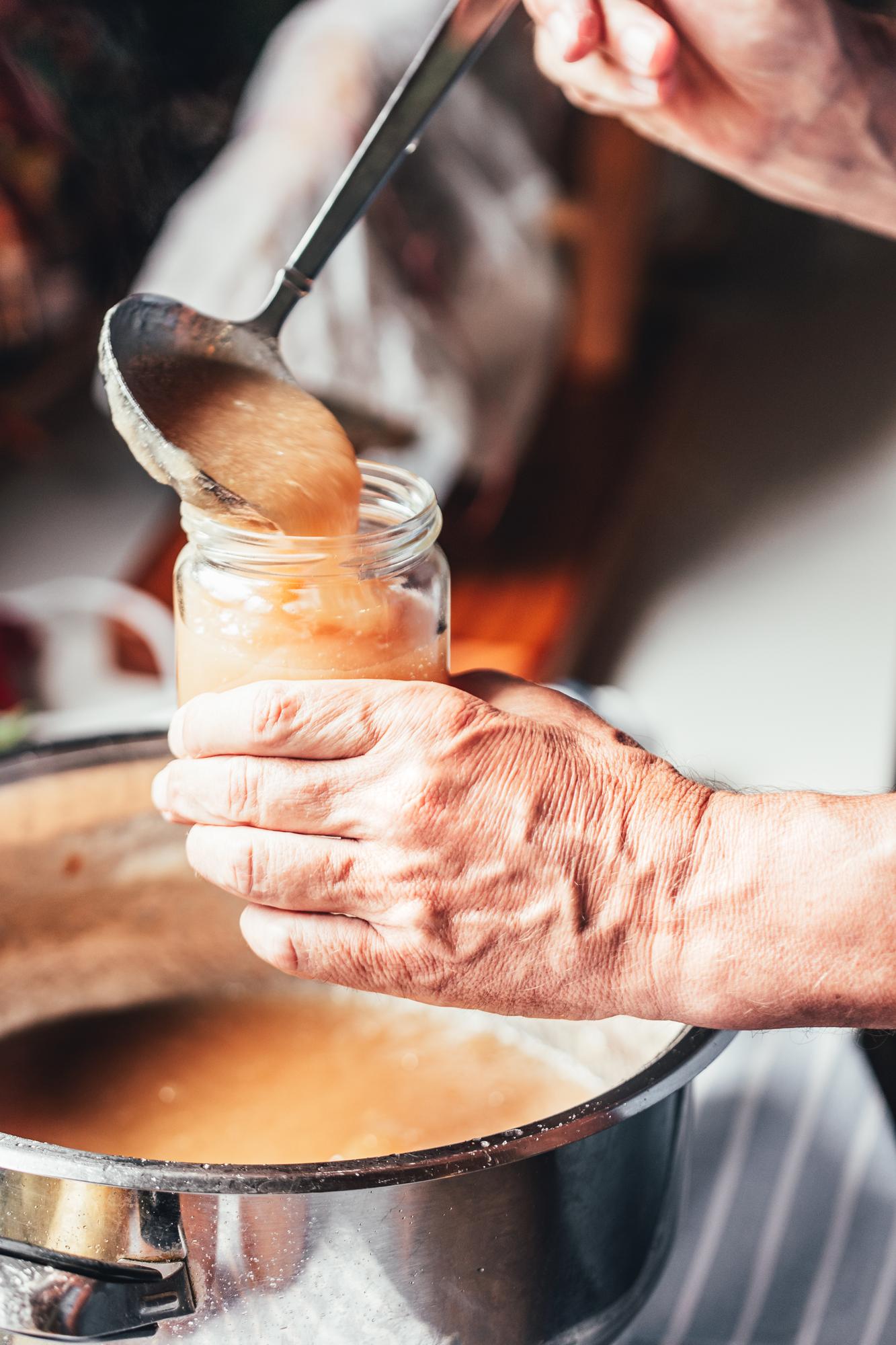 Close-up of chef preparing sauce in a small kitchen atelier